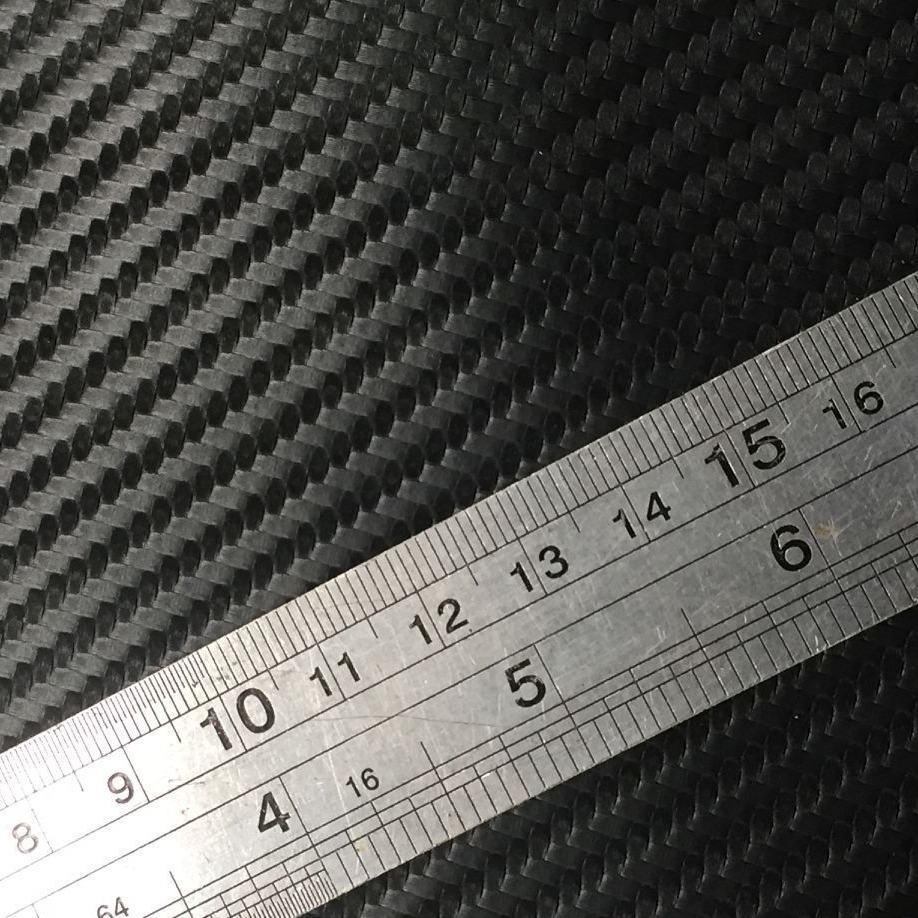 现货供应仿碳纤维编织纹 草席纹PU皮革0.6布底适用各类电子包装