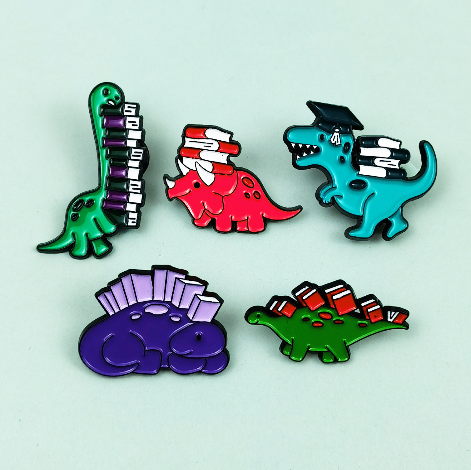 Insignia de broche de aceite de gota de aleación de dibujos animados, joyería europea y americana transfronteriza, lindo dinosaurio, aprendizaje, accesorios de libro, broche en stock