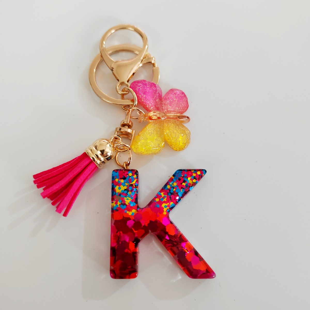 Ventas transfronterizas calientes de letras inglesas de color mixto colgante de llavero colgante de mariposa fringe de resina de llavero colgante de joyería