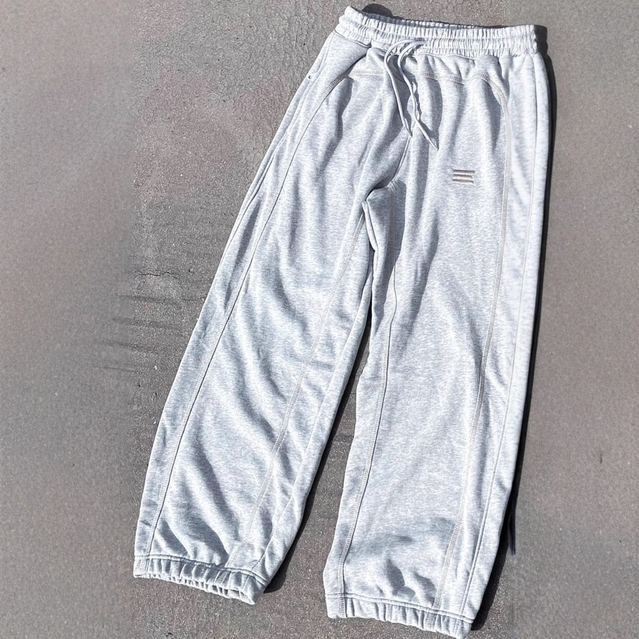Pantalones deportivos versátiles, holgados e informales unisex, con bordado de estilo hip-hop urbano transfronterizo europeo y americano.