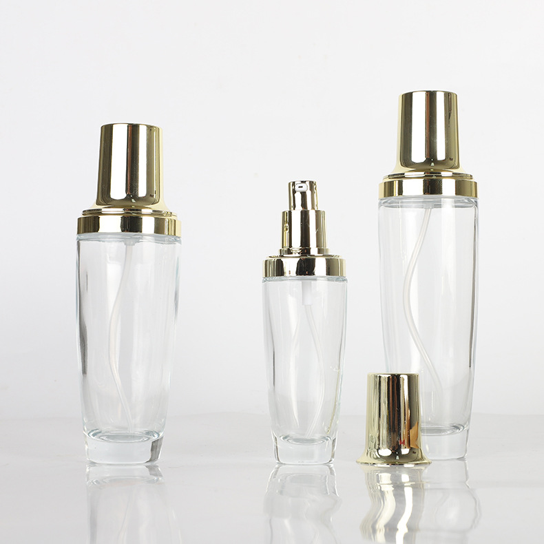Tapa de oro transparente botella de vidrio esencia botella de loción crema cosmética crema conjunto botella aceite esencial sub-embalaje botella de spray