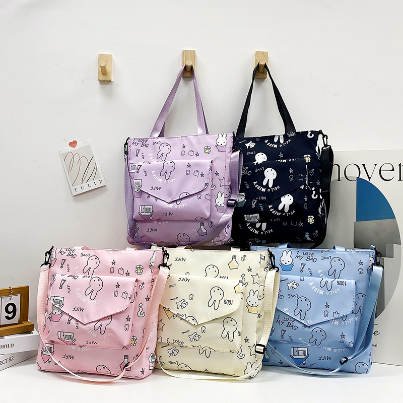 ins小众兔头涂鸦学生上课书包2025秋季大容量少女补课斜挎单肩包