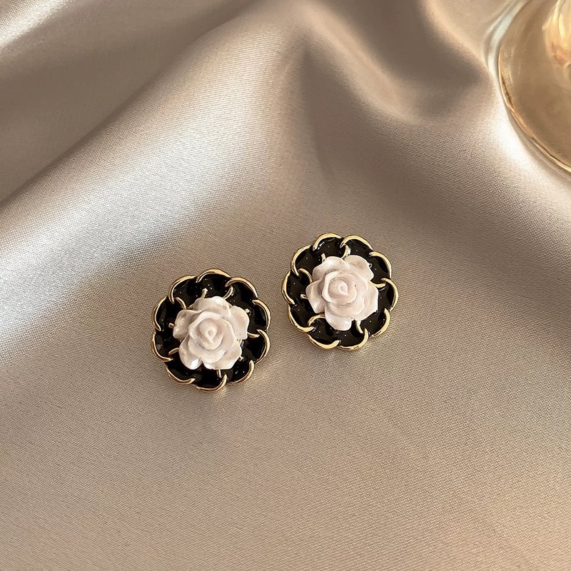 26 # Black camellia triangle ear clip