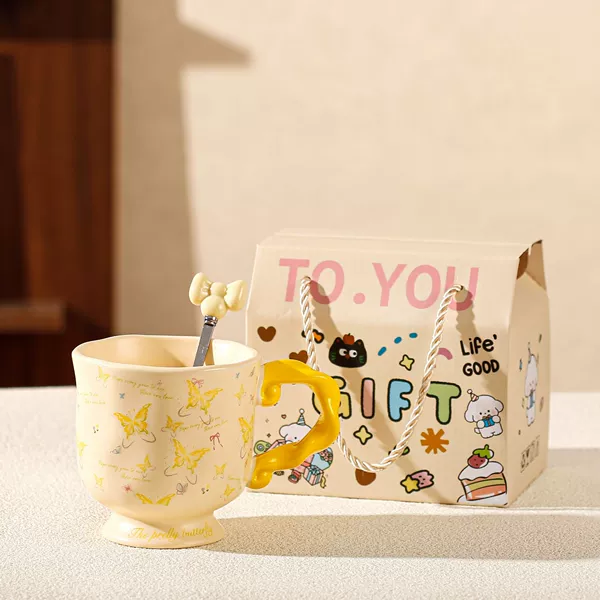 Tall yellow butterfly cup suitcase with spoon