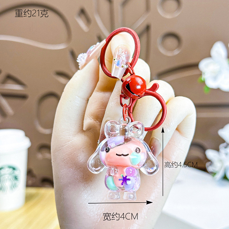 Caricatura creativa adorable acrílico frijoles de azúcar fluir arena jade Gui perro llavero colgante adornos puestos de productos al por mayor