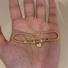 赤い本の爆発的な愛のそろばんのブレスレットの女性の黄色のファッションの高級品の大衆はdiyの手の串を設計して代行します。