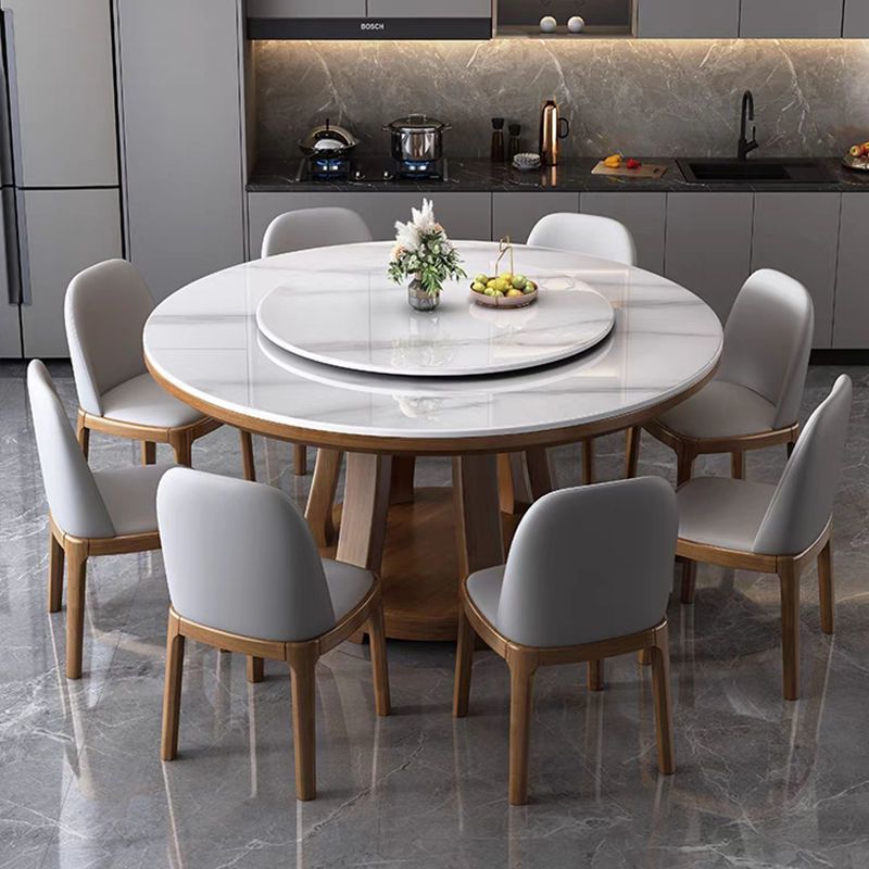 Mesa de comedor de tabla de roca de lujo ligera, mesa redonda de madera maciza doméstica con mesa giratoria, mesa de comedor redonda de alta gama con horno electromagnético rojo.