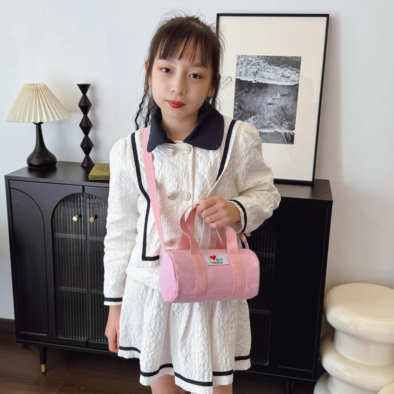 Bolsas de cubos coreanas para niños y niñas, letras de aire extranjero, bolsas de viaje casuales para niños, 2025 nuevas bolsas de lona para niños
