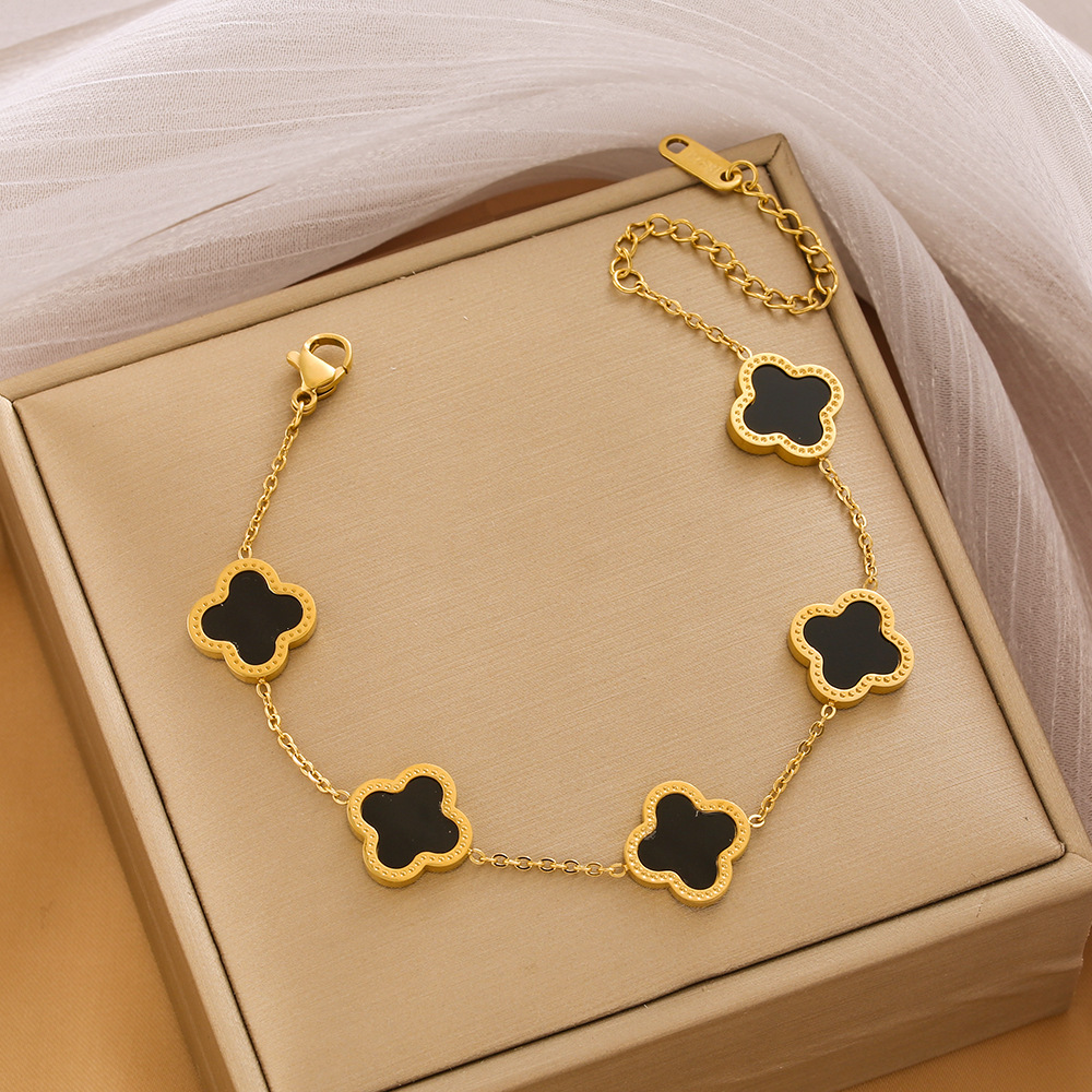 Pulsera de trébol de acero titanium vendedora caliente transfronteriza europea y americana con incrustaciones de concha pulsera colgante pulsera de diseño avanzado sin desvanecimiento al por mayor