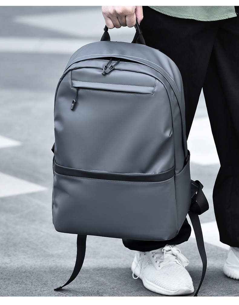 A new minimalist backpack for men, a Korean-style casual and fashionable backpack for laptops, with a logo printed on it undefined