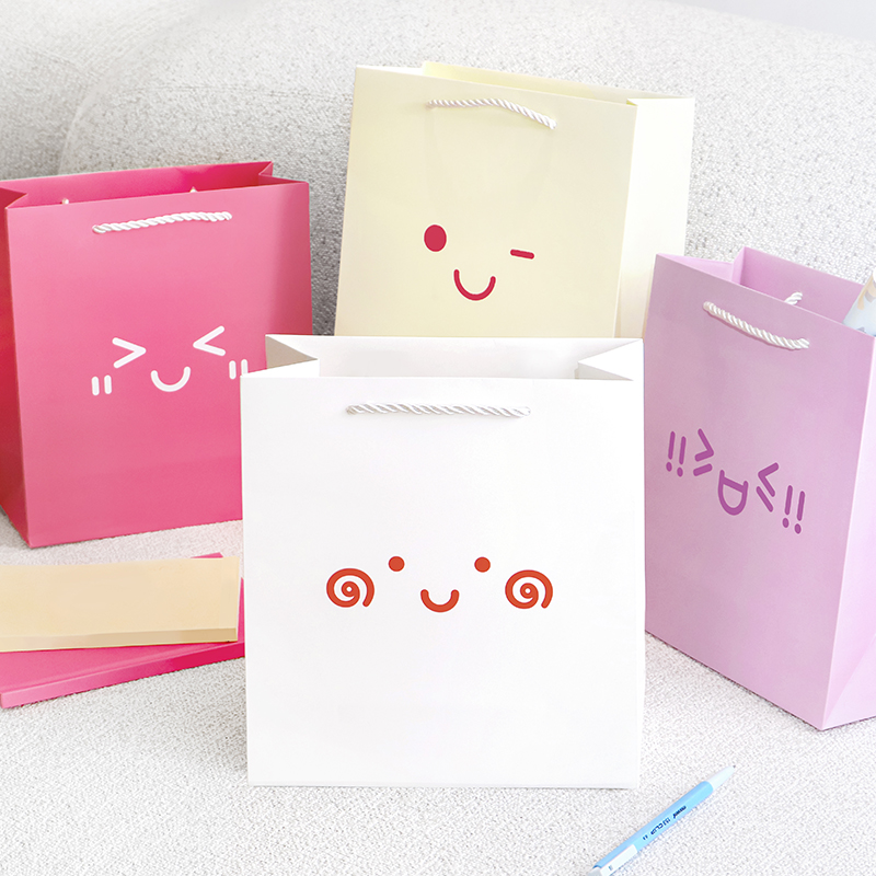 Ins simple señal de emoción bolsa de regalo de alto valor emoji regalo de cumpleaños bolsa de flores