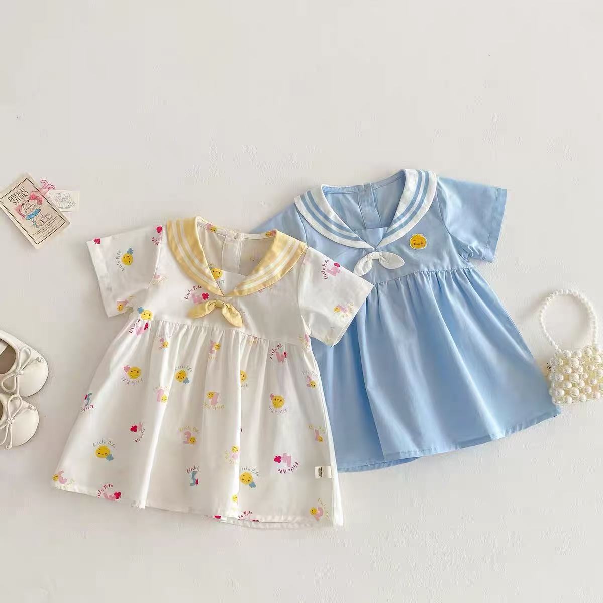 Vestido súper lindo para niñas nuevo verano bebé lindo vestido de manga corta de dibujos animados de verano azul marino