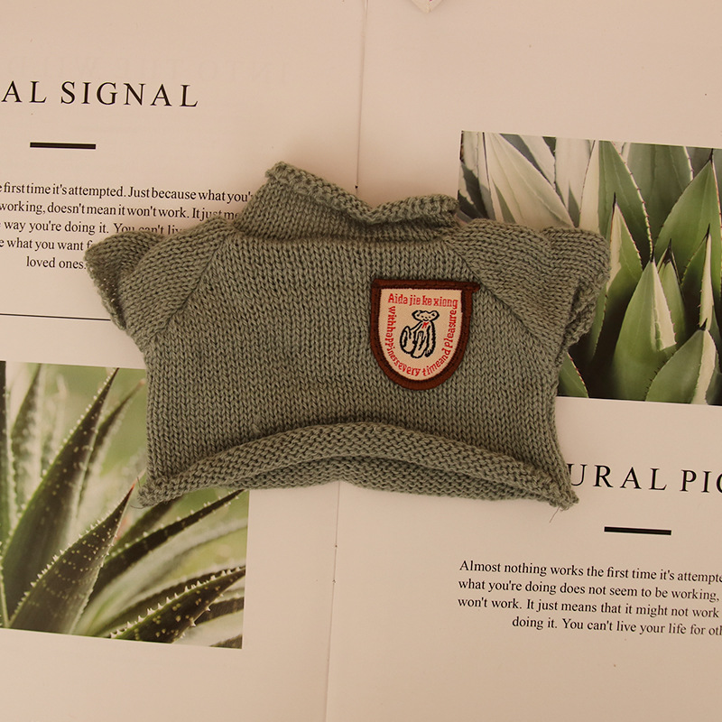 Suéter de muñeca de peluche oso de peluche con dientes perdidos ropa de muñeca máquina de agarre para mascotas accesorios de muñeca suéter camiseta al por mayor