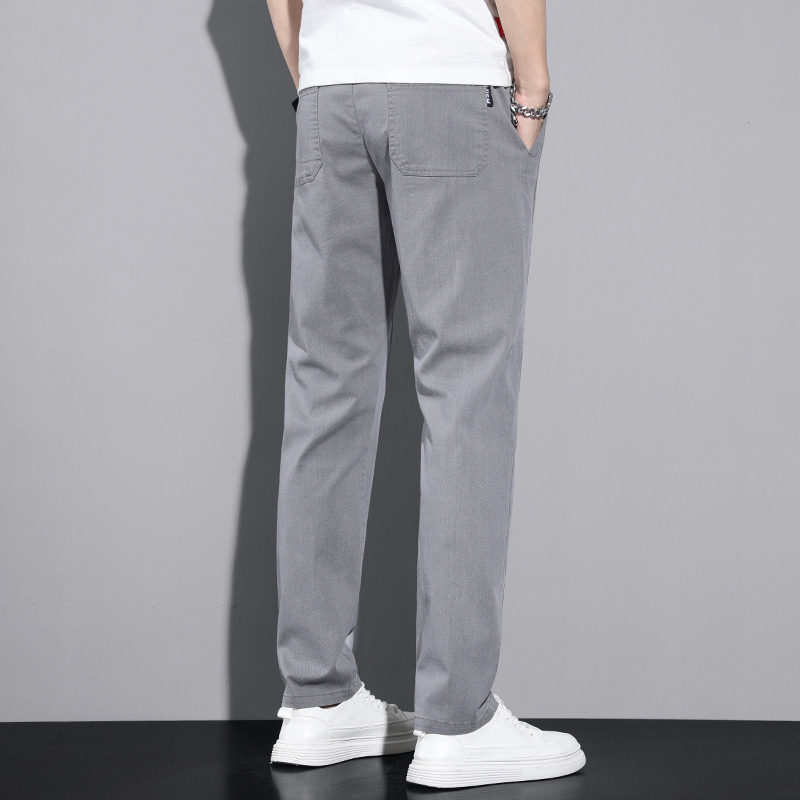 Four Seasons pantalones casuales transpirables micro elásticos para hombres jóvenes estilo coreano versátil pantalones largos rectos sueltos para hombres