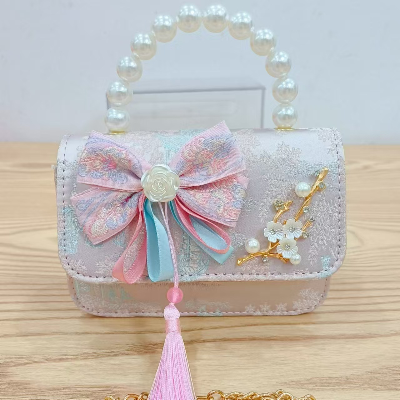 Bolsas de niños arco de estilo chino borda de niña pequeña princesa perla bolsa de cambio de mano al por mayor