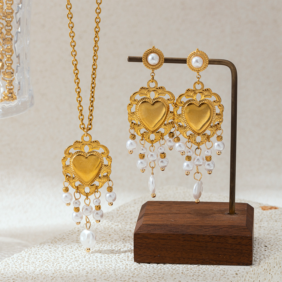 Taina estilo europeo y americano acero inoxidable perla de rosca amor collar pendientes conjunto de joyería de acero titanio para mujeres no desvanecerse transfronterizo