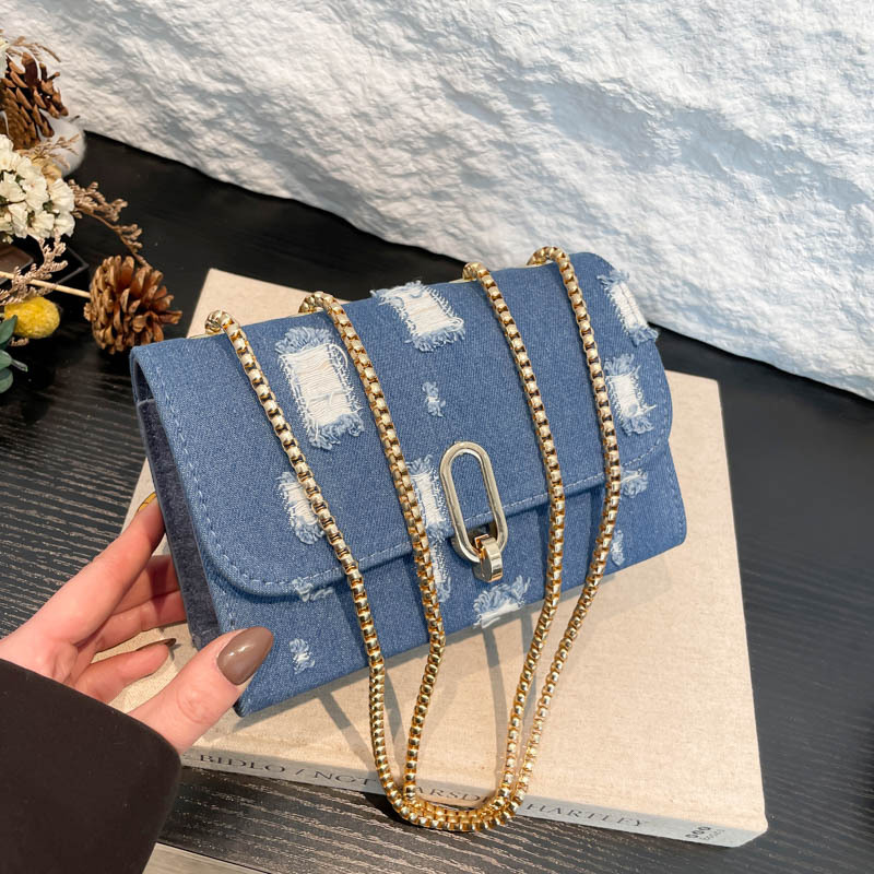 Textura de bolso cuadrado nuevo diseño de agujero de tejido denim de diseño de moda de este año chaîne de mujer mochila