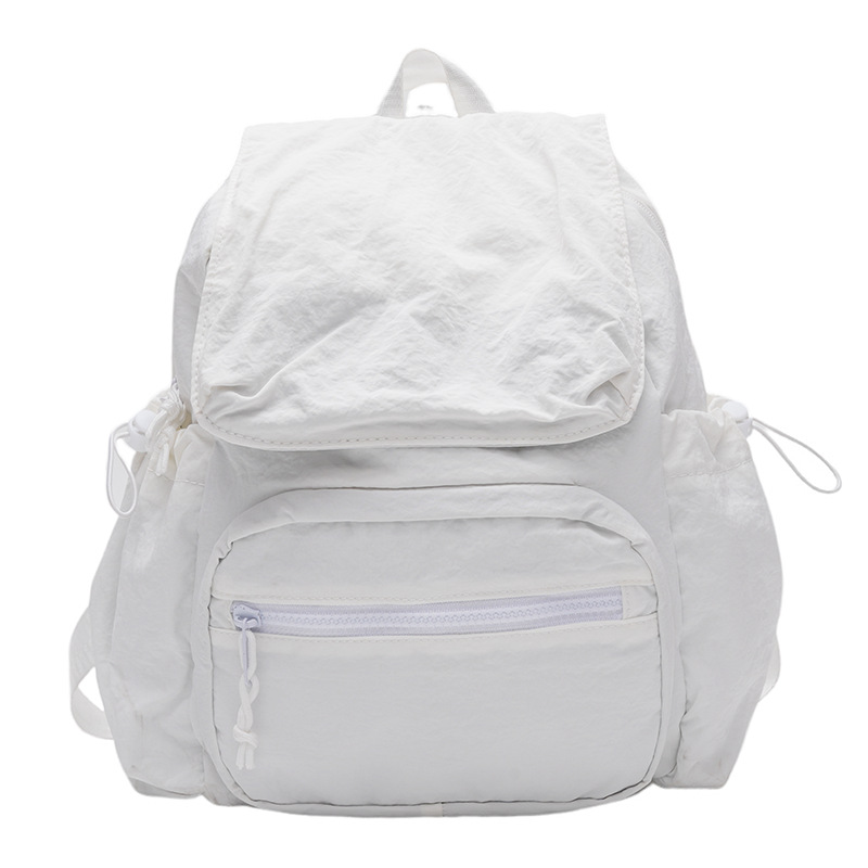 2024 nueva mochila casual de nailon, mochila escolar pequeña de color sólido de viaje coreano, bolsa de clase ligera de gran capacidad y versátil