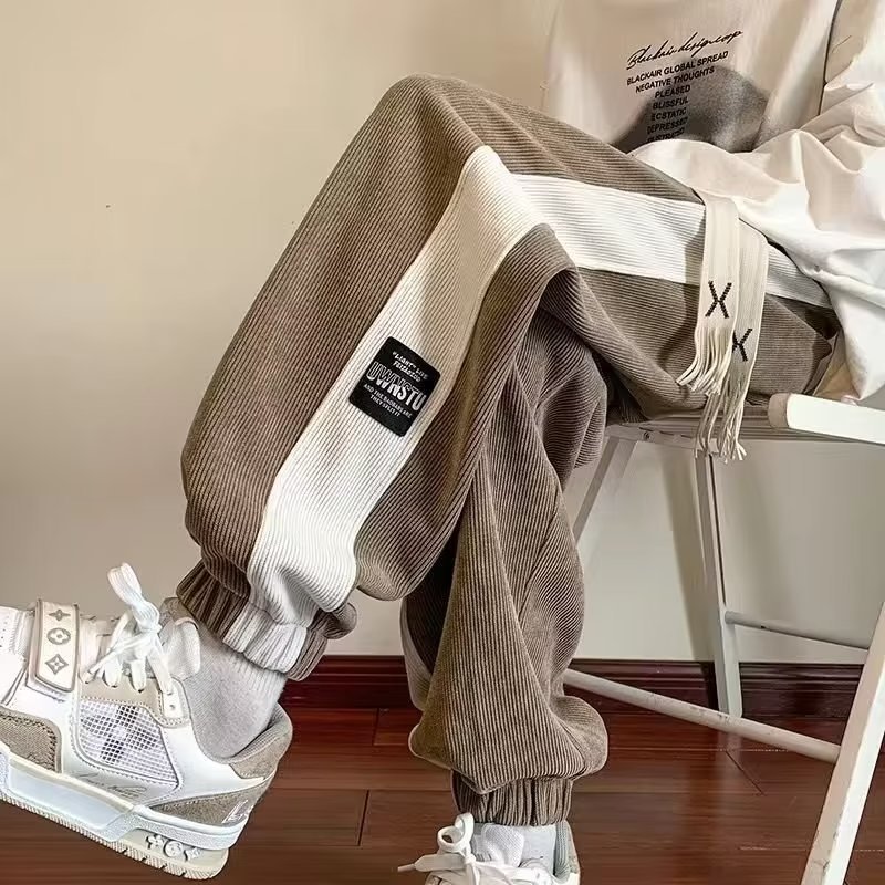 Pantalones deportivos pesados, pantalones de todo fósforo de otoño e invierno para hombres, pantalones casuales de chenilla, más pantalones largos de pana de la marca de moda de terciopelo