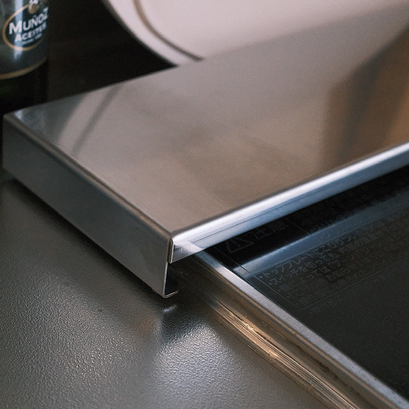 Amazonas japonés puerto de escape de acero inoxidable cubierta estufa de gas puerto de escape deflector a prueba de aceite Cocina de Inducción condimento rack