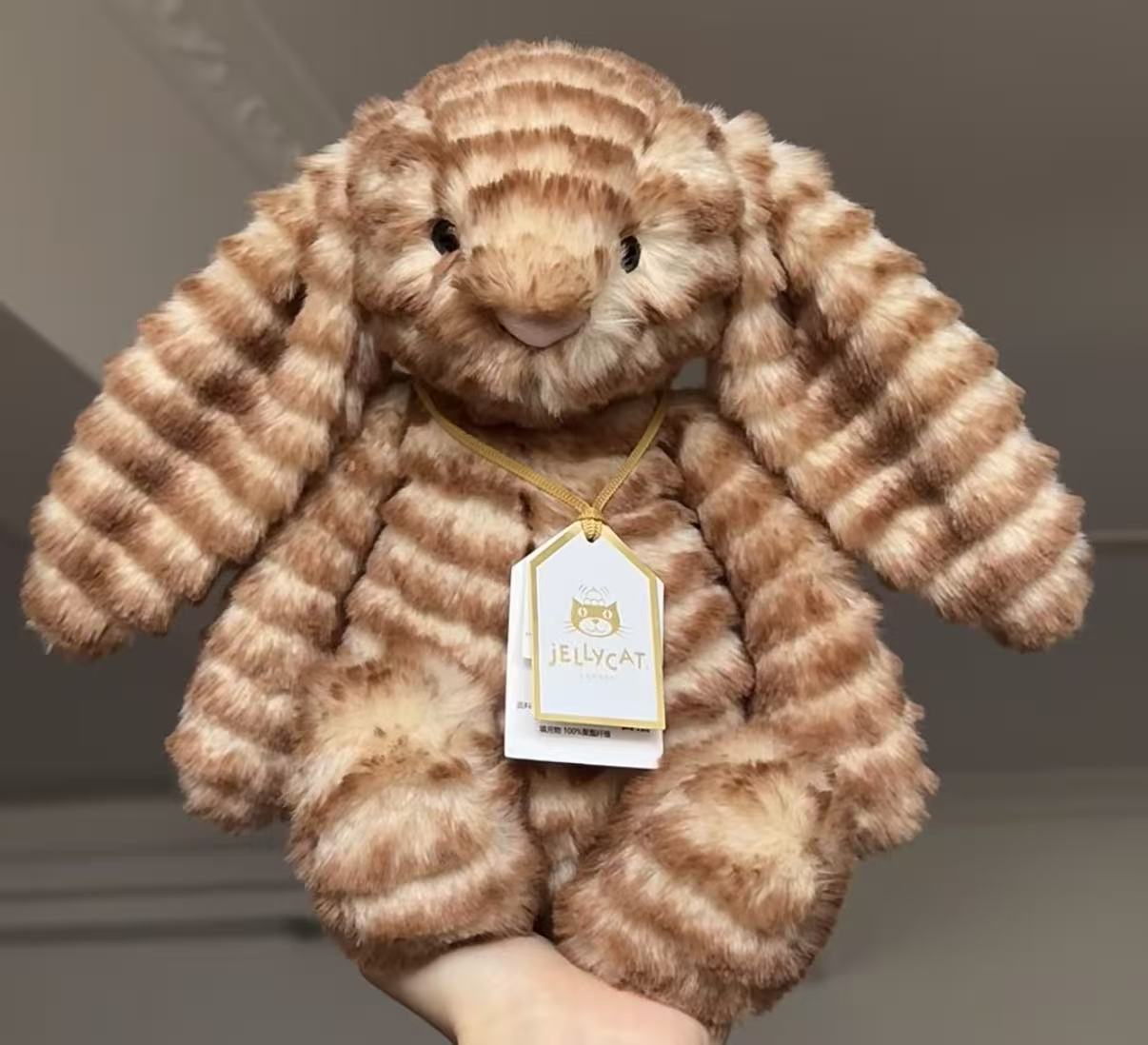 元のイギリスジェリーcatシリーズのぬいぐるみの超全合集3b斉防塵袋のバーゼル熊の手の花