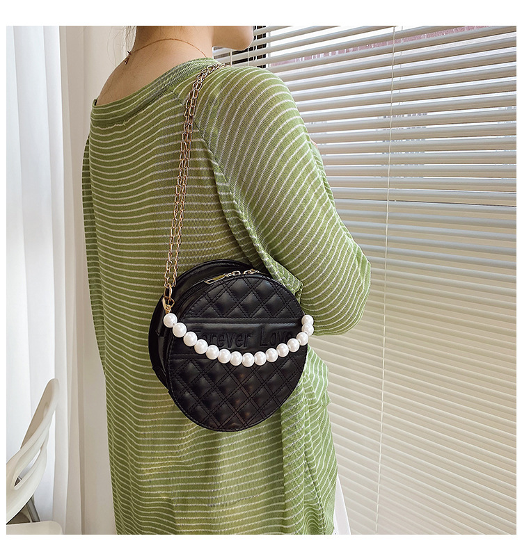 Fashion Solid Color Embossed Pearl Handle Small Round Bag display picture 13