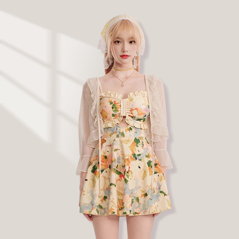 Trajes de baño divididos de mujer temperamento francés vestido de té de flores cortas de verano de manga larga protección solar trajes de baño de vacaciones mujeres