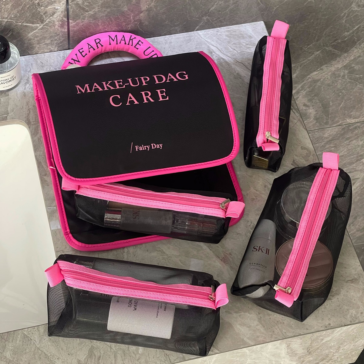 2024 nuevo bolso de lavado de perlas cuatro en uno portátil de gran capacidad alta sensación plegable bolsa de maquillaje para productos de cuidado de la piel de viaje