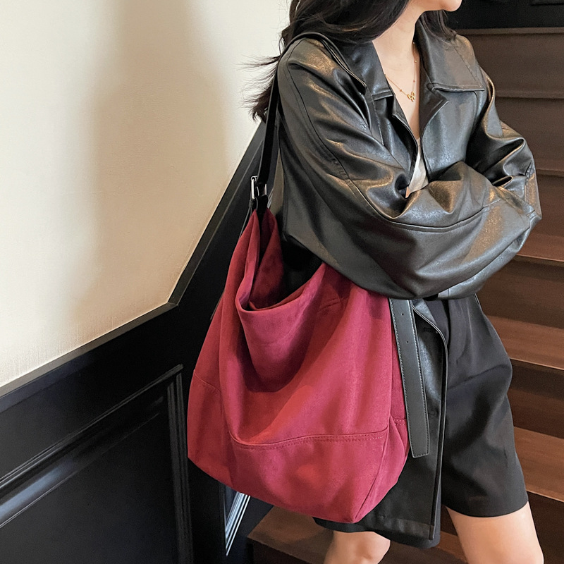 Bolsa de cubo de gran capacidad esmerizada transfronteriza para mujeres 2025, otoño y invierno, nueva bolsa de hombro coreana de alto valor de cara, bolsa de tendencia debajo de la axila