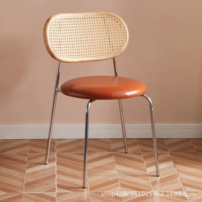 Respaldo de madera contrachapada - cojín de piel naranja - piernas de plata