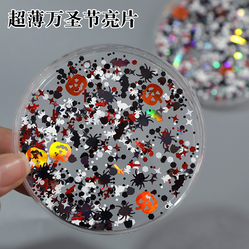 Ultra-thin Halloween nail art sequins with skull, ghost face, pumpkin, spider, and horror motifs, available in stock