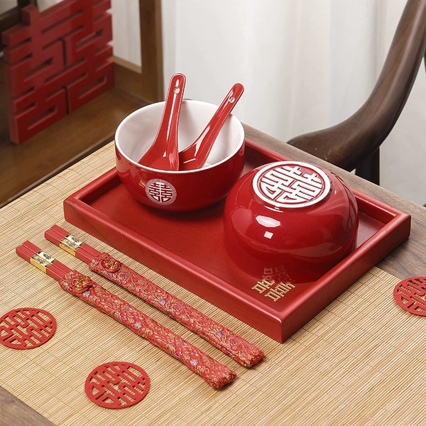 A pair of red bowls + small square plates