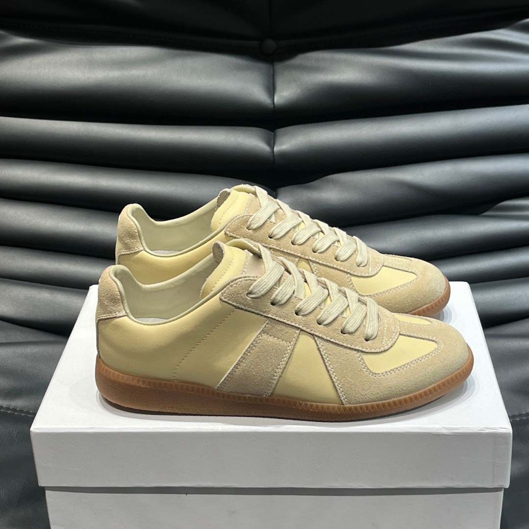 Estación europea 2025 nuevos zapatos de entrenamiento alemanes para hombres y mujeres zapatos planos casuales de todo fósforo zapatos de pareja con cordones de cuero zapatillas de deporte