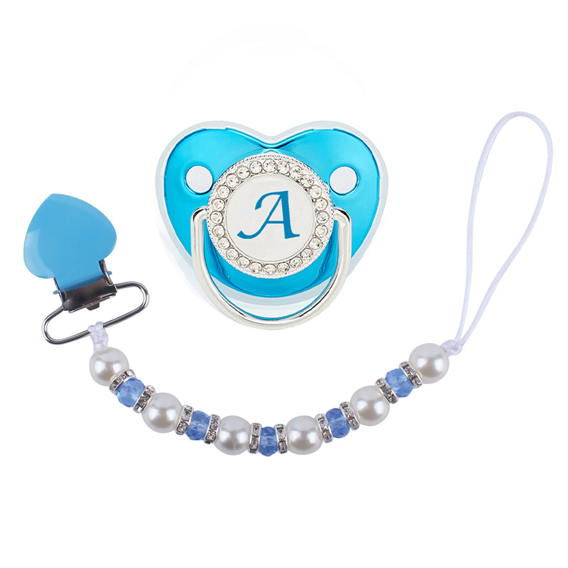 Nuevo bebé suministros melocotón corazón clip de hierro calmante bebé perla cristal chupete cadena anti-gota cadena chupete traje