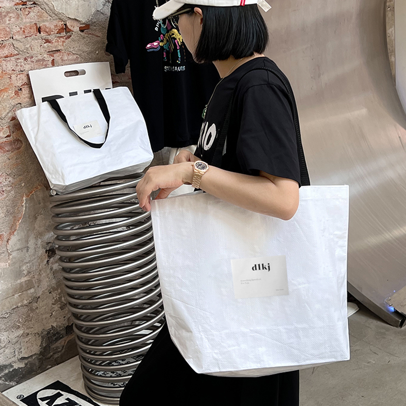 Tienda de ropa bolsa de tejido impresa LOGO ropa de mujer bolsa de compras regalos ropa al por mayor bolsa personalizada