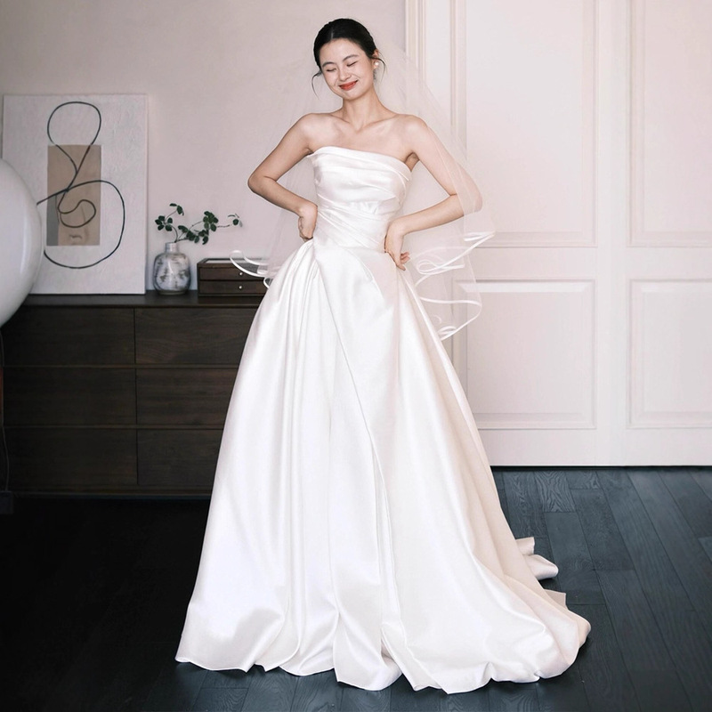 French-style satin strapless light wedding dress for brides, simple and elegant, with a forest-inspired design, white with a small train, suitable for welcoming guests French-style satin strapless light wedding dress for brides, simple and elegant, with a forest-inspired design, white with a small train, suitable for welcoming guests