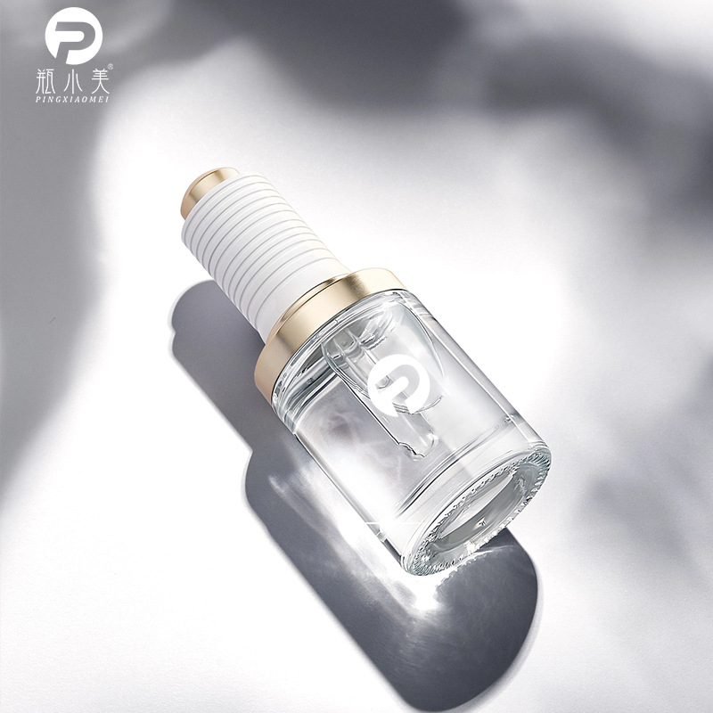 现货供应 轻奢肩套滴管玻璃瓶 30ml按压泵头圆柱形精华液瓶