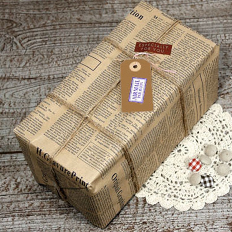 Suministro directo de fábrica retro periódico inglés papel Kraft papel de regalo papel de embalaje de flores de embalaje de ramo de dibujos animados