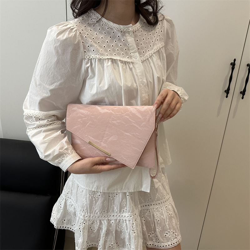 Bolso de cena de estilo coreano simple y versátil para mujer, lujo ligero, personalidad de color sólido exquisito, temperamento casual, bolso de mano avanzado