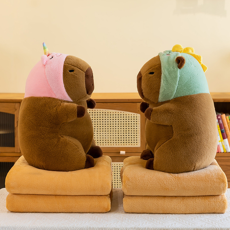 Caricatura capibara almohada manta dos en uno Carpibara cojín aire acondicionado es de doble uso niños siesta manta regalo