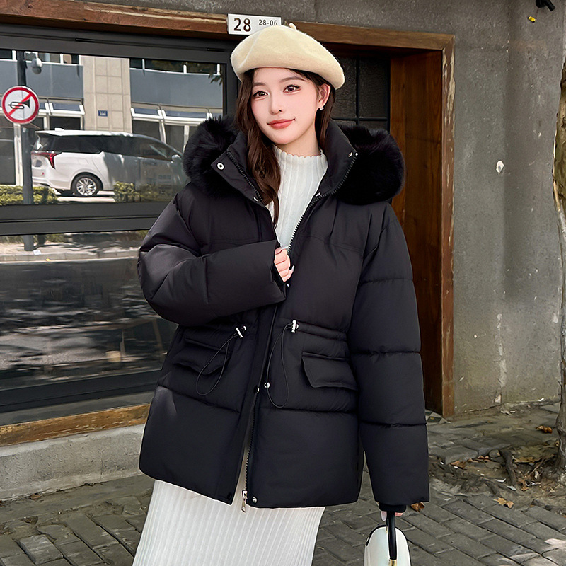 Invierno de 2025 nuevo estilo encapuchado cuello de pelo temperamento cintura retraída chaqueta de algodón de moda suelta chaqueta de algodón gruesa de moda