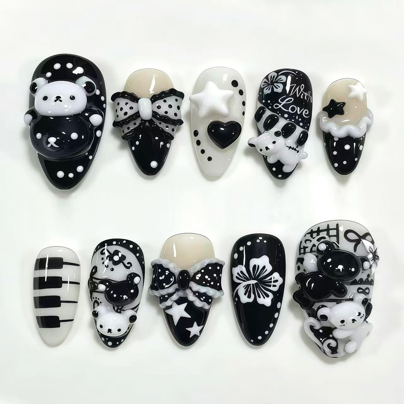 Vintage-style black and white piano 3D bear nail art, a popular cross-border Instagram trend, featuring ultra-short almond-shaped nail tips Vintage-style black and white piano 3D bear nail art, a popular cross-border Instagram trend, featuring ultra-short almond-shaped nail tips