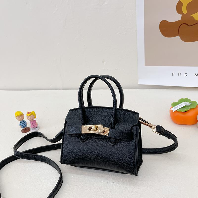 Bolsa para niños nueva pasarela europea y americana moda bolsa de platino estilo occidental niña bolsa de mensajero forma cóncava monedero comercio exterior