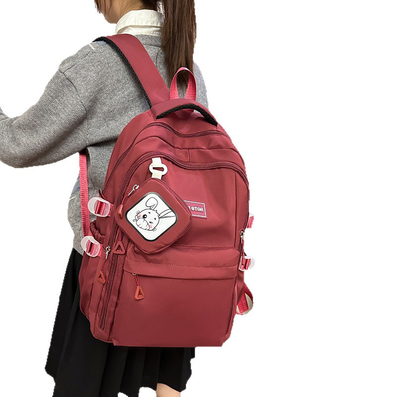 Mochila de estudiantes de moda simple 2025 nueva mochila casual de color sólido mochila de viaje de gran capacidad soporte personalizado