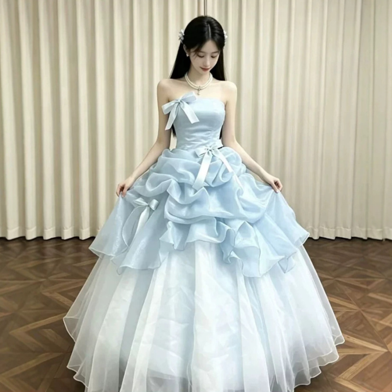 Light blue strapless dress with a bow, featuring multiple layers of ruffled tulle, perfect for a coming-of-age ceremony, a stunning evening gown, and a long dress for women Light blue strapless dress with a bow, featuring multiple layers of ruffled tulle, perfect for a coming-of-age ceremony, a stunning evening gown, and a long dress for women