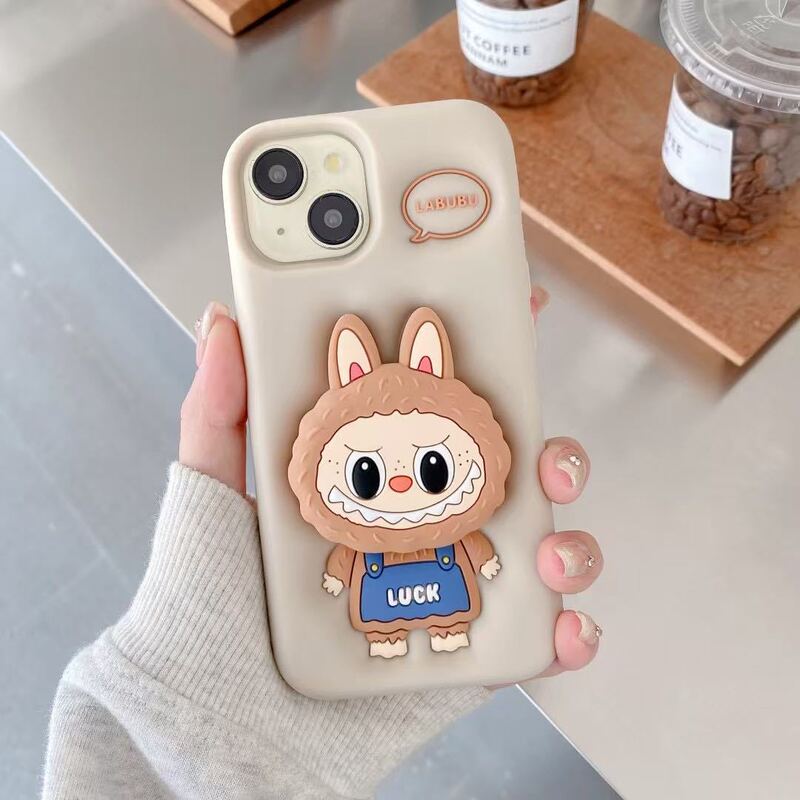 漫画風のかわいいラブブ付きスタンド付きスマホケース、Apple iPhone16/15/13/14対応、シリコン製、滑り止め|undefined