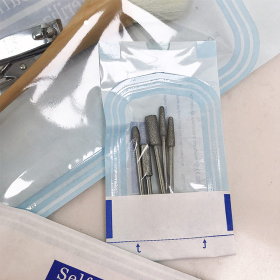 Disposable nail disinfection bag nail removal polishing dust brush dead skin scissors tool storage high temperature resistant packaging UV