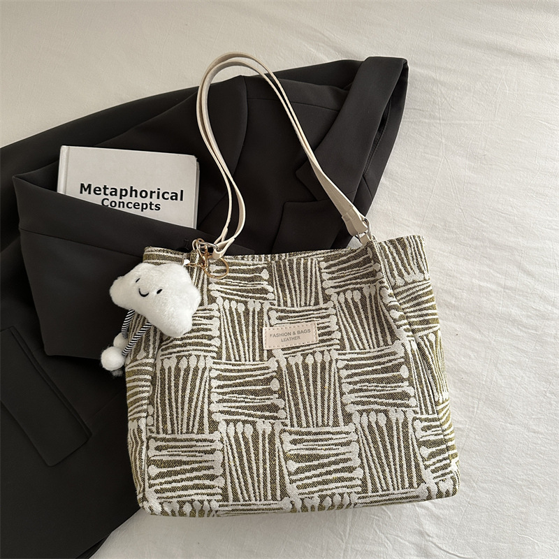 Bolso a rayas casual de todos los partidos de nicho para mujer 2024 nuevo bolso de hombro de gran capacidad de moda retro bolso de viaje