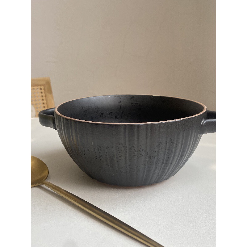 Designer-style Japanese retro black ceramic soup bowl with double handles, featuring a textured rim and raised patterns, suitable for ramen and other dishes, and designed to prevent burns when holding