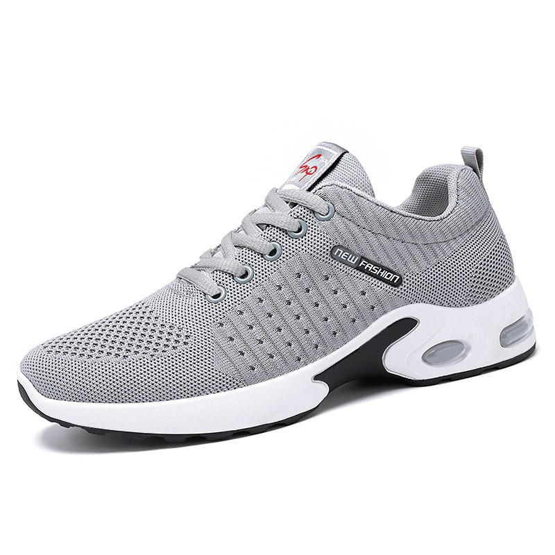 Zapatos de hombre nuevo comercio exterior transfronterizo zapatos de hombre estilo coreano tejido volador cojín de aire zapatos de suela blanda tendencia de moda zapatos deportivos transpirables hombres